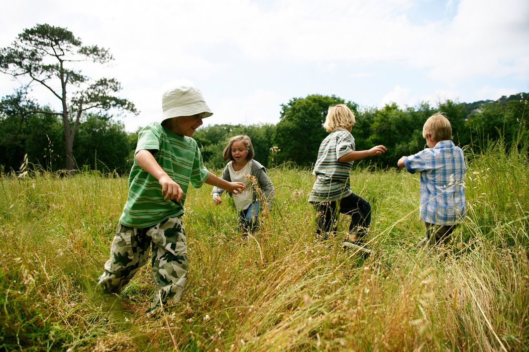 Young children playing outdoors